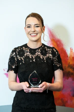 Aliscia Burrows holding her Award [photograph]