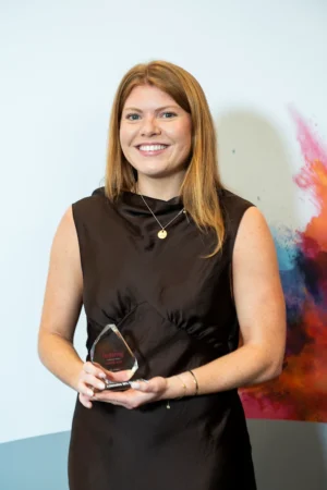 Alyx Gregory holding her Award [photograph]