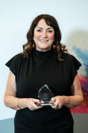 Clare Bradley holding her Award [photograph]