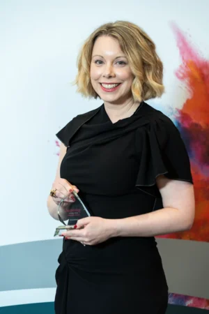 Emma Johnson holding her Award [photograph]