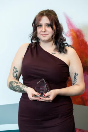 Georgia Spybey holding her Award [photograph]
