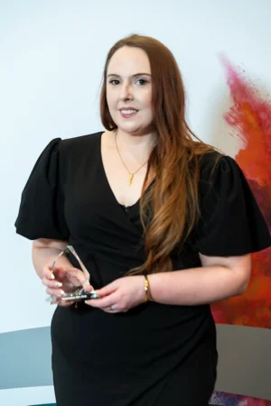 Kayleigh Smithers holding her Award [photograph]
