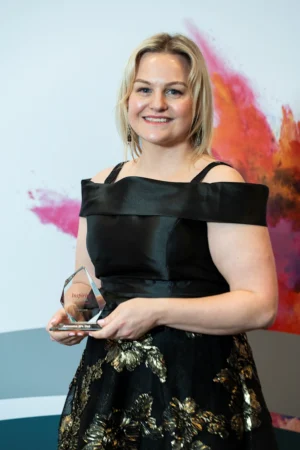 Lorraine Dodd holding her Award [photograph]