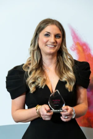 Vicky Gardner holding her Award [photograph]
