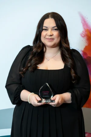 Vikki Chauntry-Brooks holding her Award [photograph]